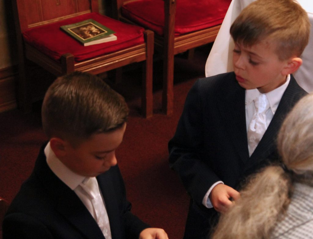 First Communion Boys wait in sacristy