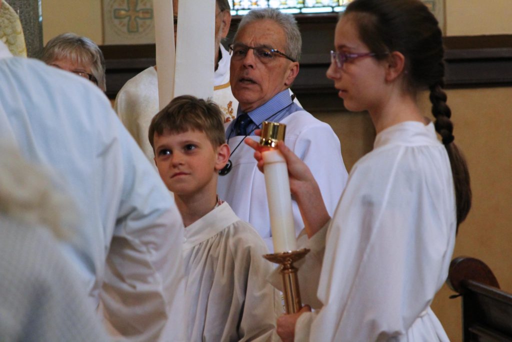 Altar servers waiting for start of First Communion Mass 