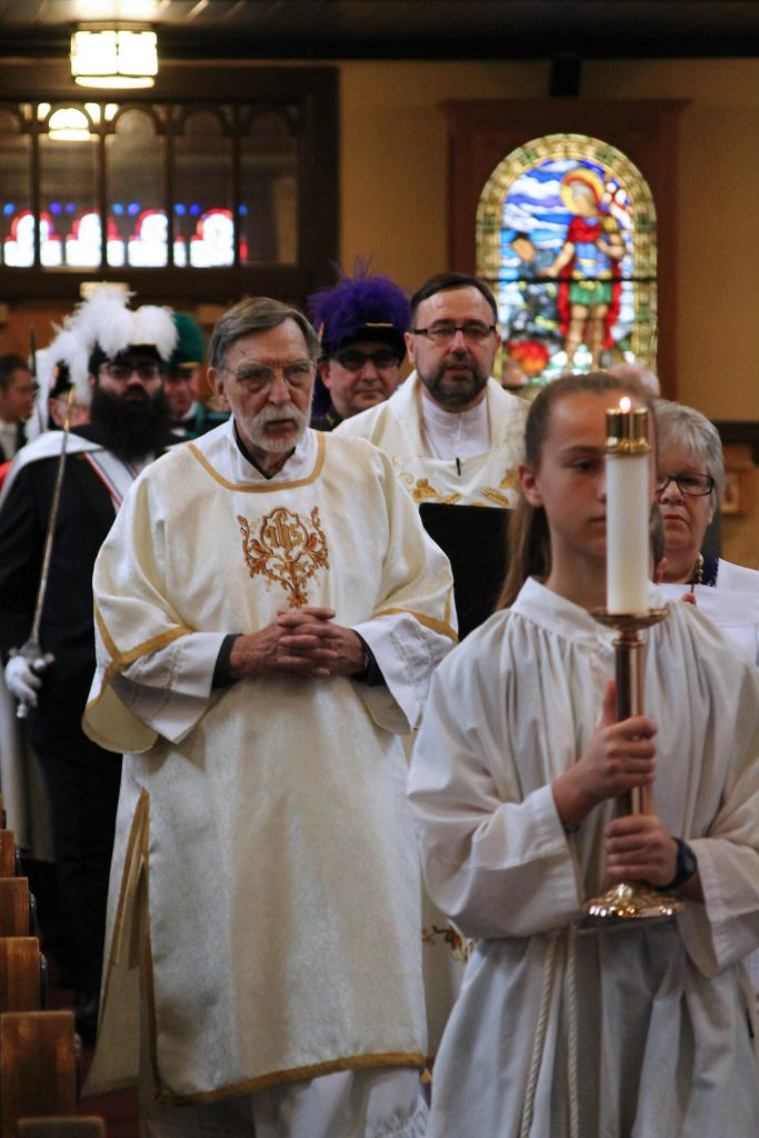 Father Roman, Deacon Ray start of First Communion Mass