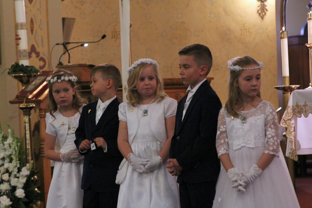 First Communion Children Face Congregation